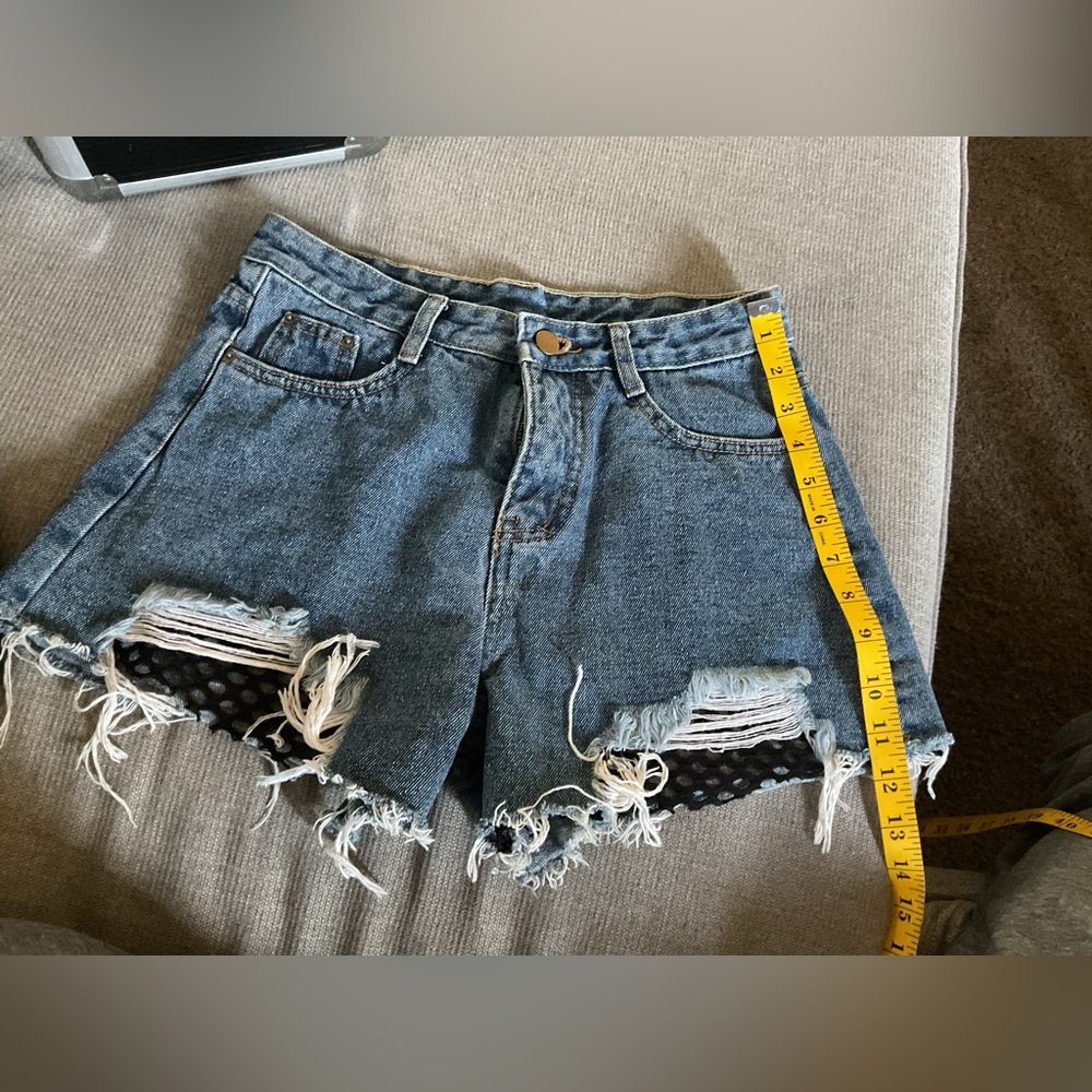 High-Rise Distressed Denim Shorts in Washed Blue (Size 31)